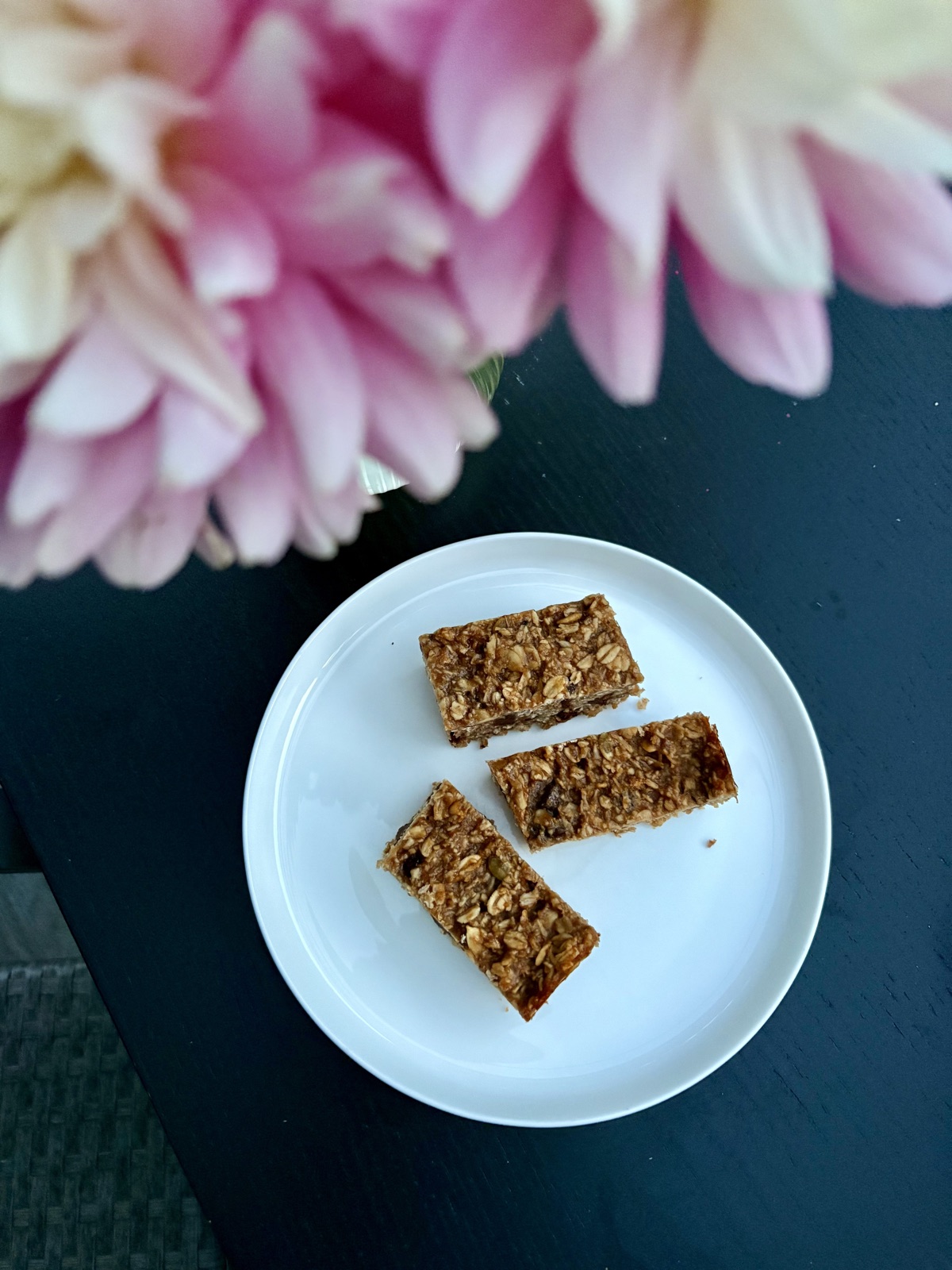 Overhead view of sliced granola bars on a white plate
